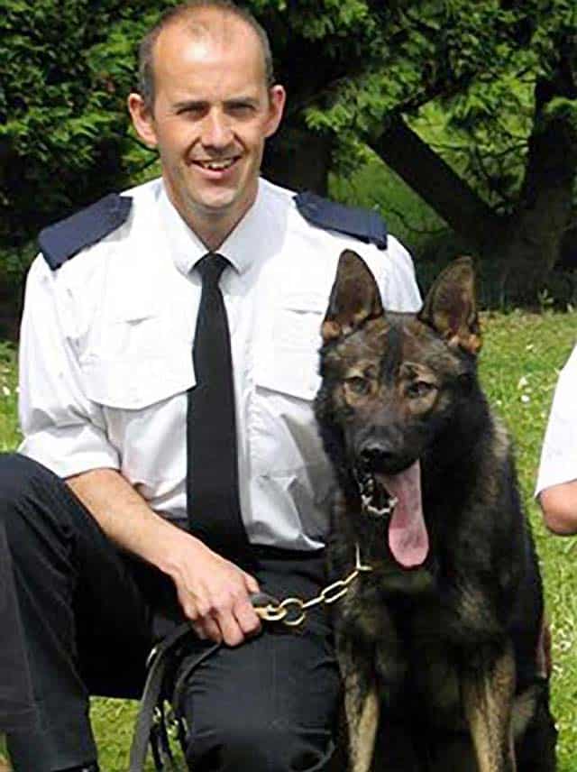 PC Gary Saunders with his police dog, Baz