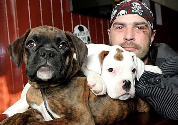 Richie Gaston posing with his two pups.
